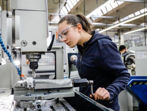 Remscheid, North Rhine-Westphalia, Germany - apprentice woman in metal professions, here at a machine tool, vocational training centre of the Remschei